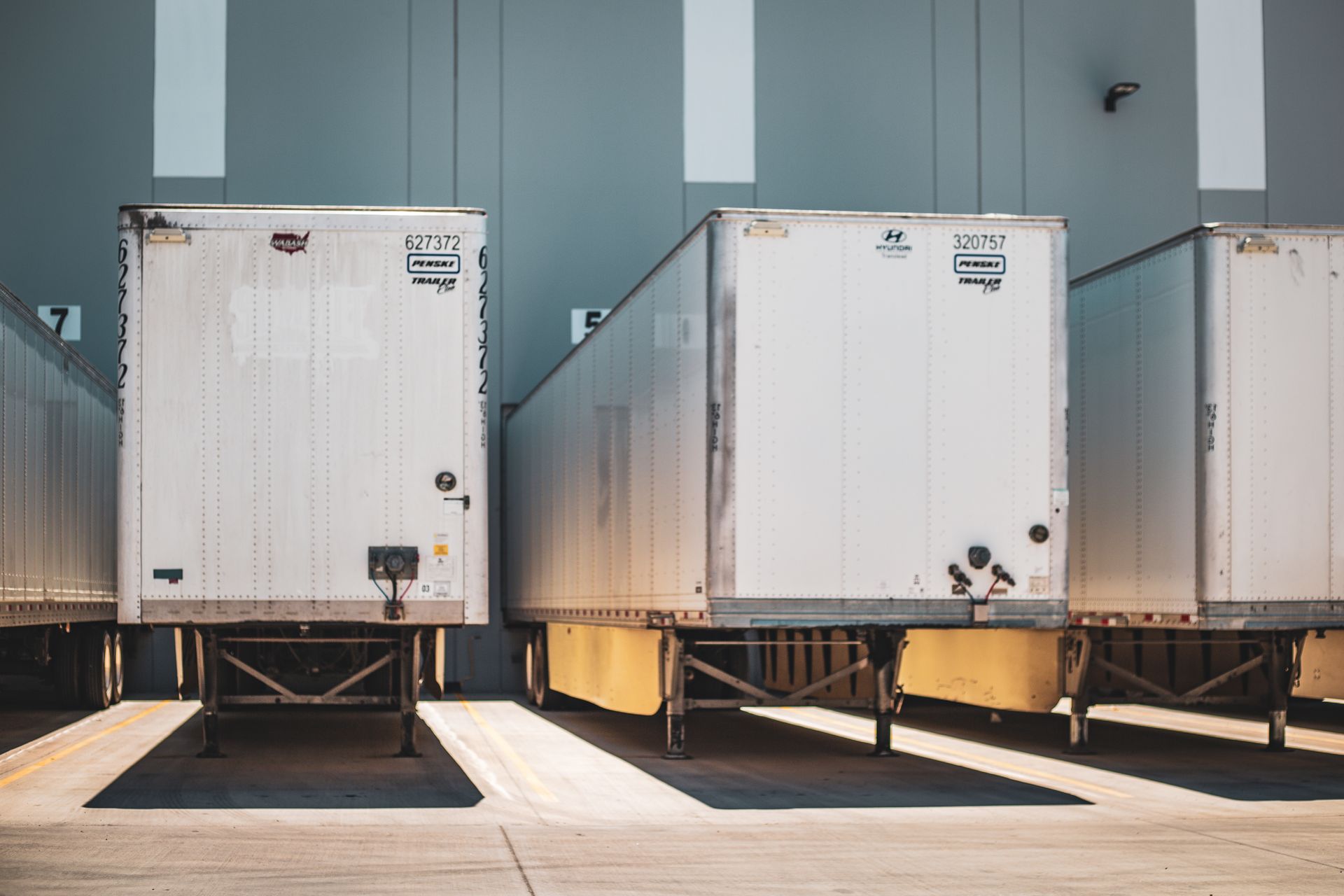 Trailers staged at loading docks of a distribution warehouse